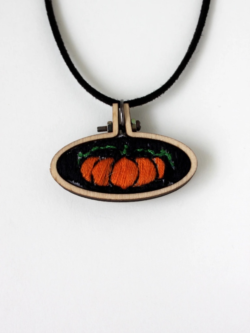 Hand embroidered pumpkin pendant